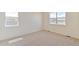 Neutral bedroom offers carpet flooring, natural light, and ample space at 13457 Valentia St, Thornton, CO 80602