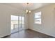 Cozy dining area features wood floors, sliding glass doors to patio, and natural light at 13457 Valentia St, Thornton, CO 80602