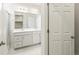 Bathroom featuring double sink vanity, tile floors, and glass shower at 17305 E 91St Pl, Commerce City, CO 80022