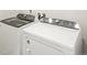 Bright laundry room, complete with washer and dryer at 17305 E 91St Pl, Commerce City, CO 80022