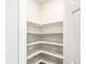 Corner pantry with ample shelving for storage at 17305 E 91St Pl, Commerce City, CO 80022