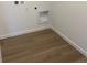 Functional laundry room with laminate flooring and new connections at 21965 E 39Th Ave, Aurora, CO 80019