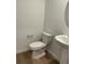 Clean powder room features modern fixtures, new toilet, and pedestal sink at 21965 E 39Th Ave, Aurora, CO 80019