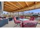Outdoor back porch complete with outdoor seating and string lights at 6893 S High St, Centennial, CO 80122