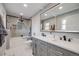 Beautiful bathroom with double vanity, sleek fixtures, and a glass-enclosed shower at 6893 S High St, Centennial, CO 80122