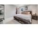Comfortable bedroom features a platform bed with wood accents and a convenient closet at 6893 S High St, Centennial, CO 80122