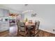 Cozy dining area with wooden table, chairs, and sliding glass door to an outdoor patio at 6893 S High St, Centennial, CO 80122