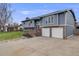 Charming two-story home with a well-manicured lawn, brick accents, and a two-car garage at 6893 S High St, Centennial, CO 80122