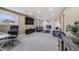 Large living room features a fireplace, a tv, and office area at 6893 S High St, Centennial, CO 80122