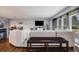 Comfortable living room with plush sectional, TV, and view into the adjacent dining area at 6893 S High St, Centennial, CO 80122