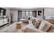Cozy living room with a comfortable sectional sofa, stylish decor, and plenty of natural light at 6893 S High St, Centennial, CO 80122