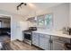 Kitchen view offers modern appliances, painted cabinets, and an abundance of natural light at 791 S Routt Way, Lakewood, CO 80226