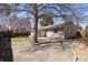 The backyard offers a patio area, mature tree providing shade, and a well-maintained lawn at 5698 E Greenwood Pl, Denver, CO 80222