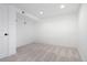 A carpeted bedroom features neutral walls, recessed lighting, and closet space at 5698 E Greenwood Pl, Denver, CO 80222