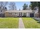 Charming single-story home featuring a well-maintained lawn and inviting curb appeal at 5698 E Greenwood Pl, Denver, CO 80222