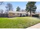 Charming single-story home with a well-maintained lawn and mature trees, offering great curb appeal at 5698 E Greenwood Pl, Denver, CO 80222