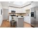 Modern kitchen with stainless steel appliances, granite countertops, and ample cabinet space at 5698 E Greenwood Pl, Denver, CO 80222