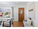 Inviting living room with a bay window, hardwood floors, and contemporary decor at 5698 E Greenwood Pl, Denver, CO 80222