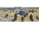 Aerial view of a two-story home with a four car garage on a large lot at 5285 La Quinta Cir, Elizabeth, CO 80107