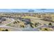 An aerial view of a two-story home that backs up to a golf course and community clubhouse at 5285 La Quinta Cir, Elizabeth, CO 80107
