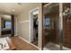 Bathroom featuring a large shower, vanity with granite countertops, soaking tub and a walk-in closet at 5285 La Quinta Cir, Elizabeth, CO 80107