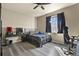Bright bedroom with a window, dark curtains, a desk, modern bed, and plenty of natural light at 5285 La Quinta Cir, Elizabeth, CO 80107