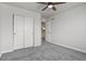 Bedroom with light walls, carpet flooring, a window letting in natural light, and a closet at 5285 La Quinta Cir, Elizabeth, CO 80107