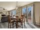 Cozy dining area with table, chairs, and sliding glass doors to the deck at 5285 La Quinta Cir, Elizabeth, CO 80107