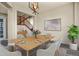 Beautifully staged dining room with modern lighting and open access to the staircase at 5285 La Quinta Cir, Elizabeth, CO 80107