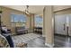 Bright entryway features hardwood floors, large windows, and neutral wall color offering a welcoming space at 5285 La Quinta Cir, Elizabeth, CO 80107
