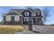 Charming two-story home with stone accents and a well-manicured lawn at 5285 La Quinta Cir, Elizabeth, CO 80107