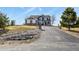 View of a two-story home with an asphalt driveway and landscaping at 5285 La Quinta Cir, Elizabeth, CO 80107