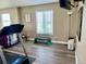 Upstairs gym area with a treadmill, weights, and a window with a view at 5285 La Quinta Cir, Elizabeth, CO 80107