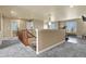 Upstairs hallway with carpet, access to other rooms, natural light, and a hanging light fixture at 5285 La Quinta Cir, Elizabeth, CO 80107
