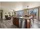 Open-concept kitchen featuring an island with a dishwasher at 5285 La Quinta Cir, Elizabeth, CO 80107