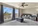 Bright living room with two big windows, plush carpeting, and a comfortable seating arrangement at 5285 La Quinta Cir, Elizabeth, CO 80107