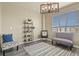 Bright living room with modern decor, hardwood floors, and large windows at 5285 La Quinta Cir, Elizabeth, CO 80107