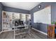 Spacious home office with built-in shelving and a large whiteboard at 5285 La Quinta Cir, Elizabeth, CO 80107