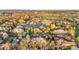 An aerial view shows the Tudor-style home's proximity to the golf course and city at 35 Brookhaven Ln, Littleton, CO 80123
