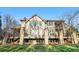The Tudor-style home has a basement walkout and a stone patio that is perfect for enjoying the back yard at 35 Brookhaven Ln, Littleton, CO 80123