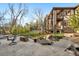 Backyard patio with stone accents and lush landscaping at 35 Brookhaven Ln, Littleton, CO 80123