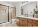 Stylish bathroom featuring glass shower, modern vanity, and sleek fixtures at 35 Brookhaven Ln, Littleton, CO 80123