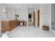Spacious bathroom with marble floors, and sinks, a walk-in shower, and vanity area at 35 Brookhaven Ln, Littleton, CO 80123