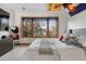 Cozy bedroom with a large window that provides natural light and street views at 35 Brookhaven Ln, Littleton, CO 80123