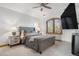 Bedroom featuring neutral paint, ceiling fan, a gray bed, with two bedside tables at 35 Brookhaven Ln, Littleton, CO 80123
