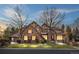 Stunning two-story stone home with inviting curb appeal and professional landscaping at 35 Brookhaven Ln, Littleton, CO 80123