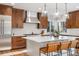 Modern kitchen featuring a spacious island, stainless steel appliances, and stylish pendant lighting at 35 Brookhaven Ln, Littleton, CO 80123