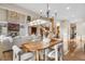 Open-concept living space featuring a dining area and fireplace, perfect for entertaining guests at 35 Brookhaven Ln, Littleton, CO 80123