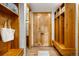 Mudroom with built-in wooden lockers, bench, and ample storage space at 35 Brookhaven Ln, Littleton, CO 80123
