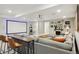 Finished basement features a large screen TV and entertaining area at 6361 Kenzie Cir, Castle Pines, CO 80108